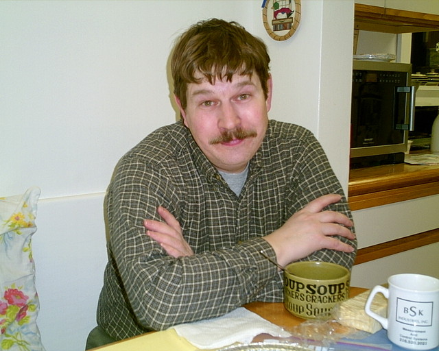 December 2003 - Mike having some soup in mom's kitchen on Frank Street